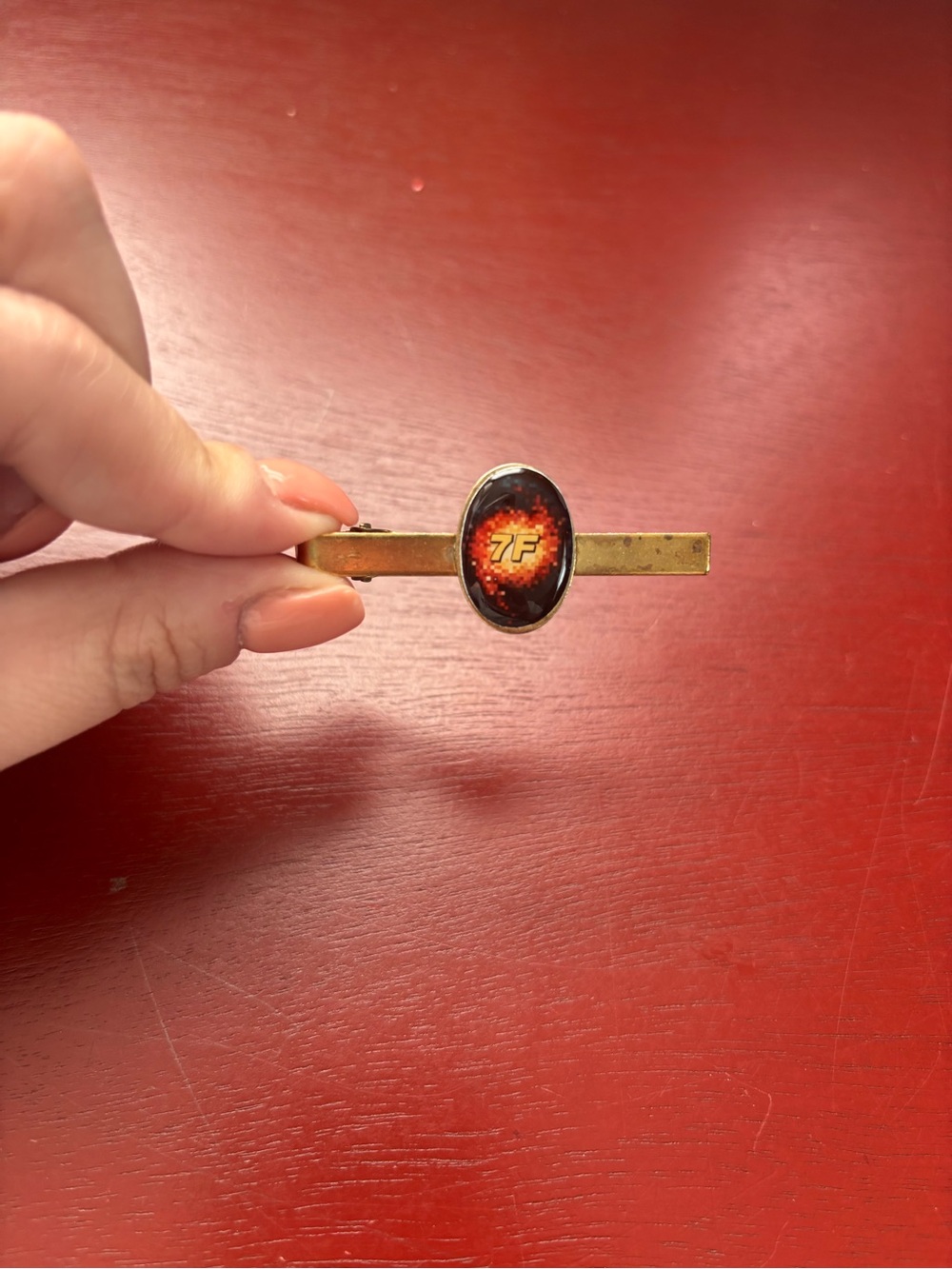 Gold Tone Tie Bar with Red Oval Emblem